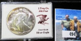 Superbly toned 1987 American Silver Eagle in hard plastic case. Gem BU.