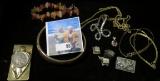 Mixed group of Old Jewelry including Charms, Money Clip, Necklaces, Bracelets, and etc.