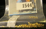 Alaska Placer Gold weighing 0.7678 grams.
