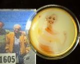 39mm Gold and Enameled Marilyn Monroe Medallion, depicts her both nude and in white lingerie.