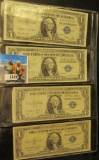 (1) Series 1935 E & (3) Series 1935 G One Dollar Silver Certificates stored in a four-pocket plastic