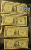 (2) Series 1957 & (2) Series 1957A  One Dollar Silver Certificates stored in a four-pocket plastic p