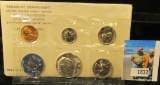 1965 U.S. Special Mint Set with 40% Silver Kennedy Half Dollar.