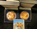 Pair of Walking Liberty One Ounce Copper rounds in special cases.