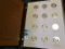 2000-2010 S Proof or Gem BU Sacagawea Dollar Set displayed in a World Coin Library album. (33 pcs.)