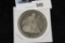 1859 O U.S. Seated Liberty “Love Token” Dollar, Initials “L.D.B”, holed.