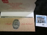 Series 1988 A One Dollar Federal Reserve Note with Santa Claus face over Washington in a Hy Vee spec