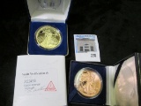 Replica of a 1933 $20 St. Gaudens Gold piece in a display box & 2011 Copper One Ounce Round with the