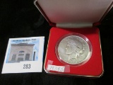 1934 S U.S. Peace Silver Dollar in a red velvet-lined case.