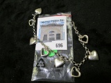 Sterling silver charm bracelet with 8 hearts, 7 1/2 inches, 11.9 grams, marked 925