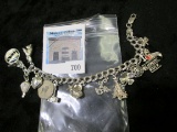 Sterling silver charm bracelet, 8 inches, 14 charms, 37.1 grams total weight
