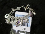 Sterling charm bracelet, 7 inches, 12 charms, 35.8 grams, marked 925