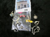 Group of eleven (11) sterling charms, includes flip-flops, sun and moons, Native American bears, gro