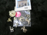 Group of eight (8) sterling silver charms, includes boot, saddle, sombrero, horses and horse shoes a