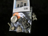 Group of five (5) silver charms, a pan, a bell, a clock, a sailor and wheel, and a St. Anne Beaupre