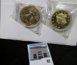 (2) American Mint Replica Gold Coins with original packaging.