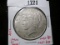 1922-D Peace Silver Dollar, UNC with obverse die break, MS63 value $85, MS64 value $150
