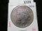 1922-S Peace Silver Dollar, AU with uniform purple toning, toned Peace Dollars are encountered far l