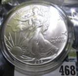 1986 One Ounce .999 Fine Silver American Eagle. BU. Encapsulated.