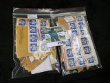 (2) Packets of 100 U.S. Official Stamps.