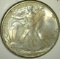 1941 Walking Liberty Half Dollar, AU58 toned (probably BU), value $32+ to $65+