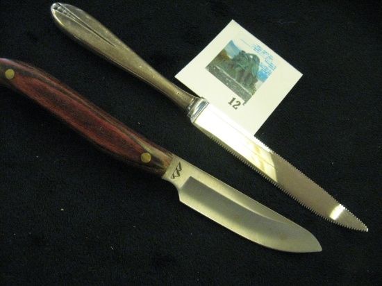 Pair of interesting knives - ROESTVRIJ hallmarked  grapefruit knife also marked STERLING, and a hand