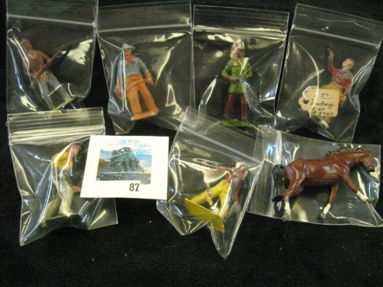 7 metal toy soldier style figures - horse, 2 indians and a cowboy with rifle, all marked BRITAINS MA