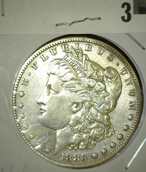 1883 P Morgan Silver Dollar.