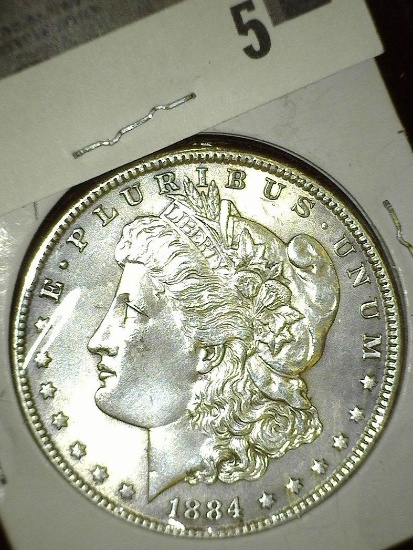 1884 P Morgan Silver Dollar, lightly toned High grade.