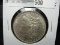 1889 P Morgan Silver Dollar. AU.