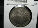 1885 O Morgan Silver Dollar, AU.