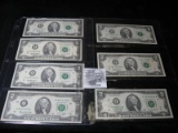 Series 1976, (5) Series 1995, & Series 2003A $2 Federal Reserve Notes in two plastic pages.