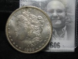 1883 O Morgan Silver Dollar, Brilliant Uncirculated. Attractive reverse toning.