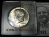 1964 P Kennedy Half Dollar in a Brenton Banks of Iowa Holder.