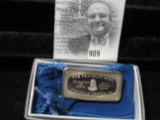 The Franklin Mint 1000 Grain Sterling Silver Bar in a felt pouch and original box of issue.