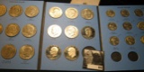Set of Eisenhower & Susan B. Anthony Dollars in a Whitman folder. Includes Proofs & BU, including th