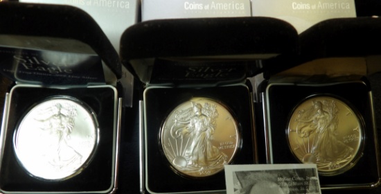 2007 & (2) 2009 American Eagle One Ounce Silver Uncirculated Dollars in velvet-lined boxes. (3 coins