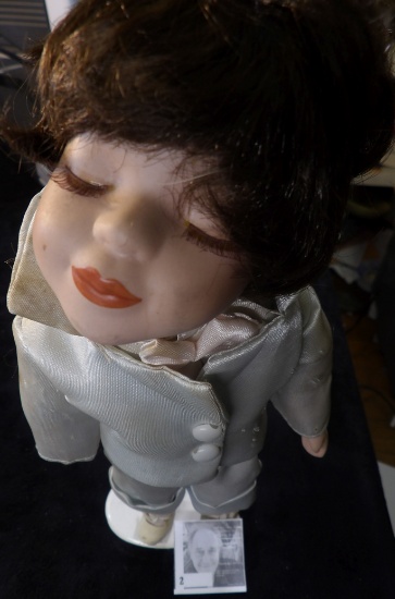 Female Doll on stand posing for a Kiss. 14" tall.