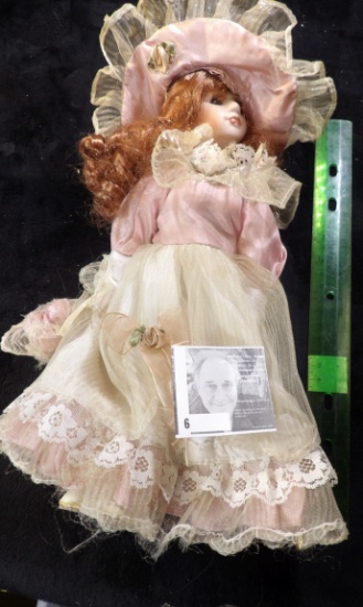 Red-headed Gorgeous Female Doll with frilly lace garb and basket. Approximately 11" in height.