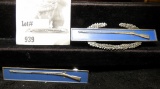 Military Pins: (2) unknown Sterling Silver Flintlock Rifle pins, both total weight 27.3 grams withou