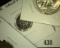 Ok Vendor Token, Wall South Dakota Token, Louisiana Quarter Token, & Cedar Valley Road Token.