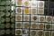 (52) various Wooden Nickels from Iowa in a pair of plastic pages.