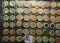 (60) various Wooden Nickels from Iowa in a pair of plastic pages.