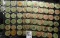 (94) various Wooden Nickels from Iowa in a pair of plastic pages.