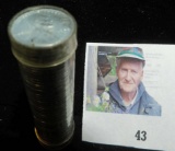 1943 D High Grade Roll of World War II Steel Cents in a plastic tube, which has shrunk holding the c