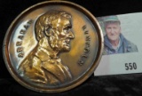 Souvenir Penny of Lincoln's New Salem, Illinois. Depicts an early stylized portrait of Abraham Linco