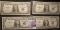 (4) High grade Series 1957 $1 Silver Certificates in plastIc sleeves.