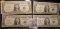 (4) High grade Series 1935 F $1 Silver Certificates in plastIc sleeves.