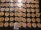 (40) Nebraska Wooden Nickels in a pair of plastic pages.