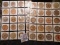 (40) Nebraska Wooden Nickels in a pair of plastic pages.